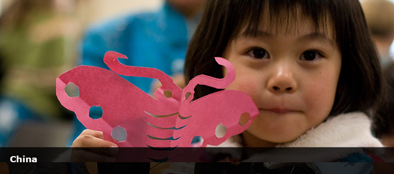 young Chinese girl with a chinese paper butterfly