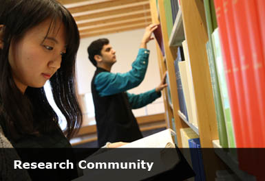 students in the library looking at books