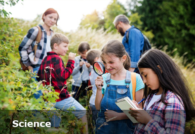 Children and teachers outdoors observing and recording the science of nature