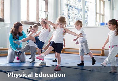 Children in a PE class balance on one leg a teacher helps a pupil who is struggling