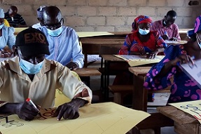 Teachers creating signs in classroom Adamawa Nigeria