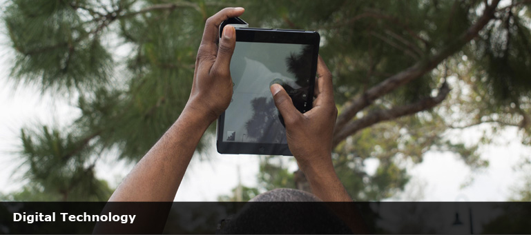 african man holding a computer tablet