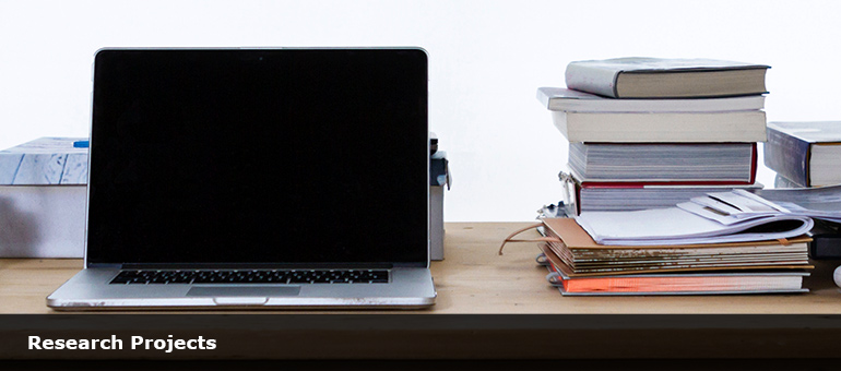 Laptop and books. Photo by freddie marriage on Unsplash. Copyright free.