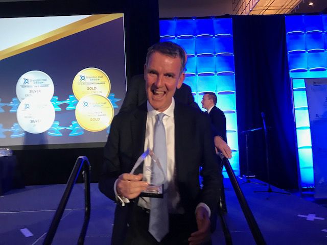Barry with his 2019 Brandon Hall Group Human Capital Award for Excellence.