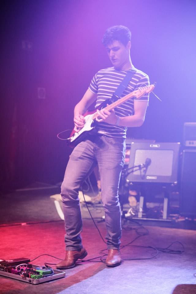 A younger Nathan on the guitar